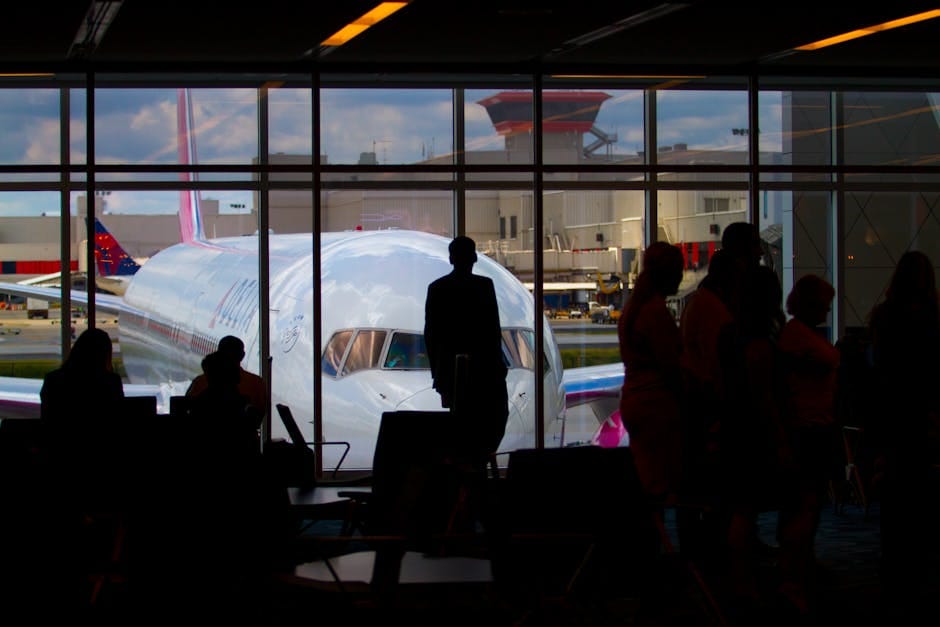 Silhouettes of travelers at airport terminal - Sri Lanka visa travel