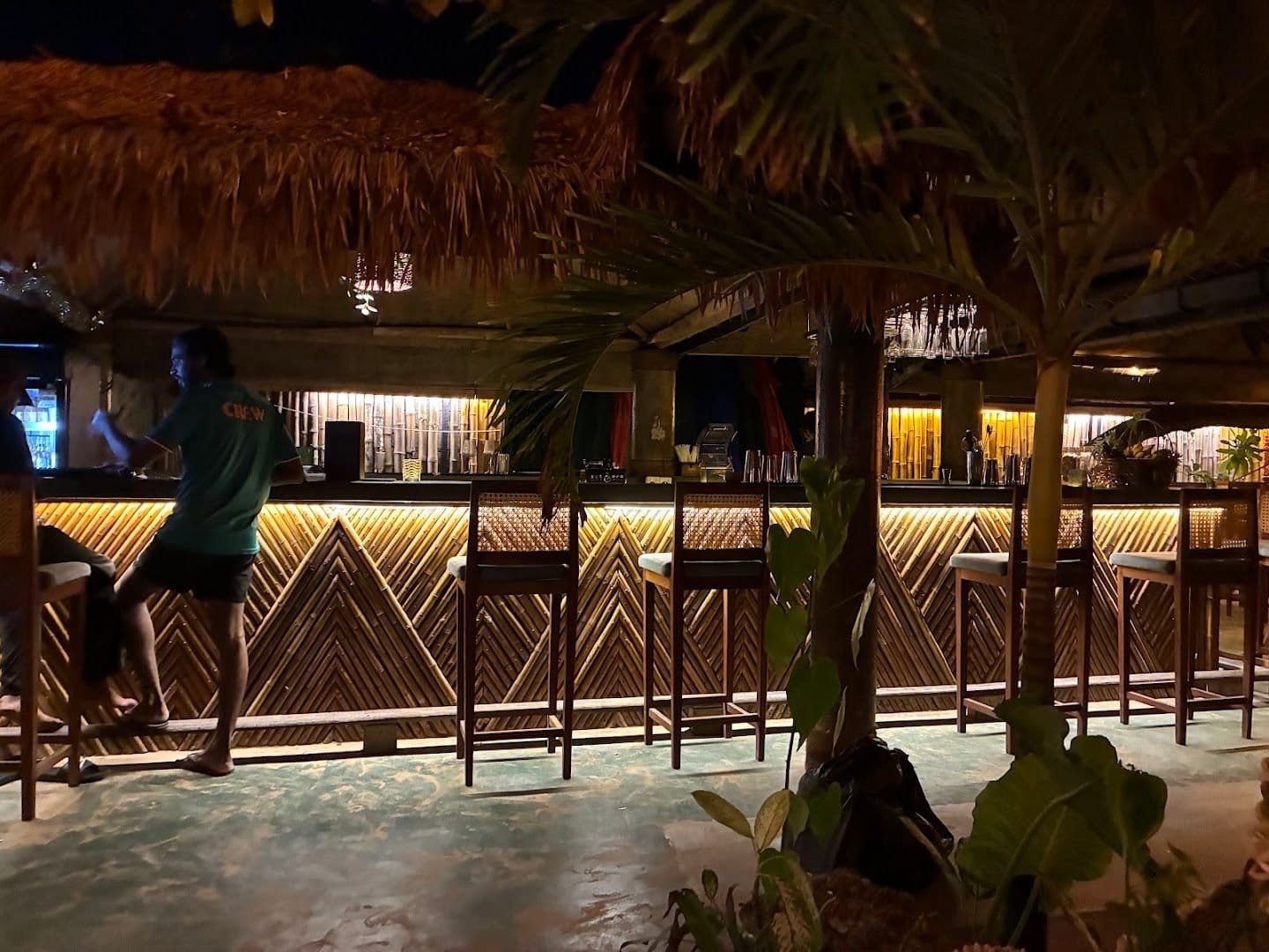 Zouk Mirissa beachfront seating with palm trees and ocean view