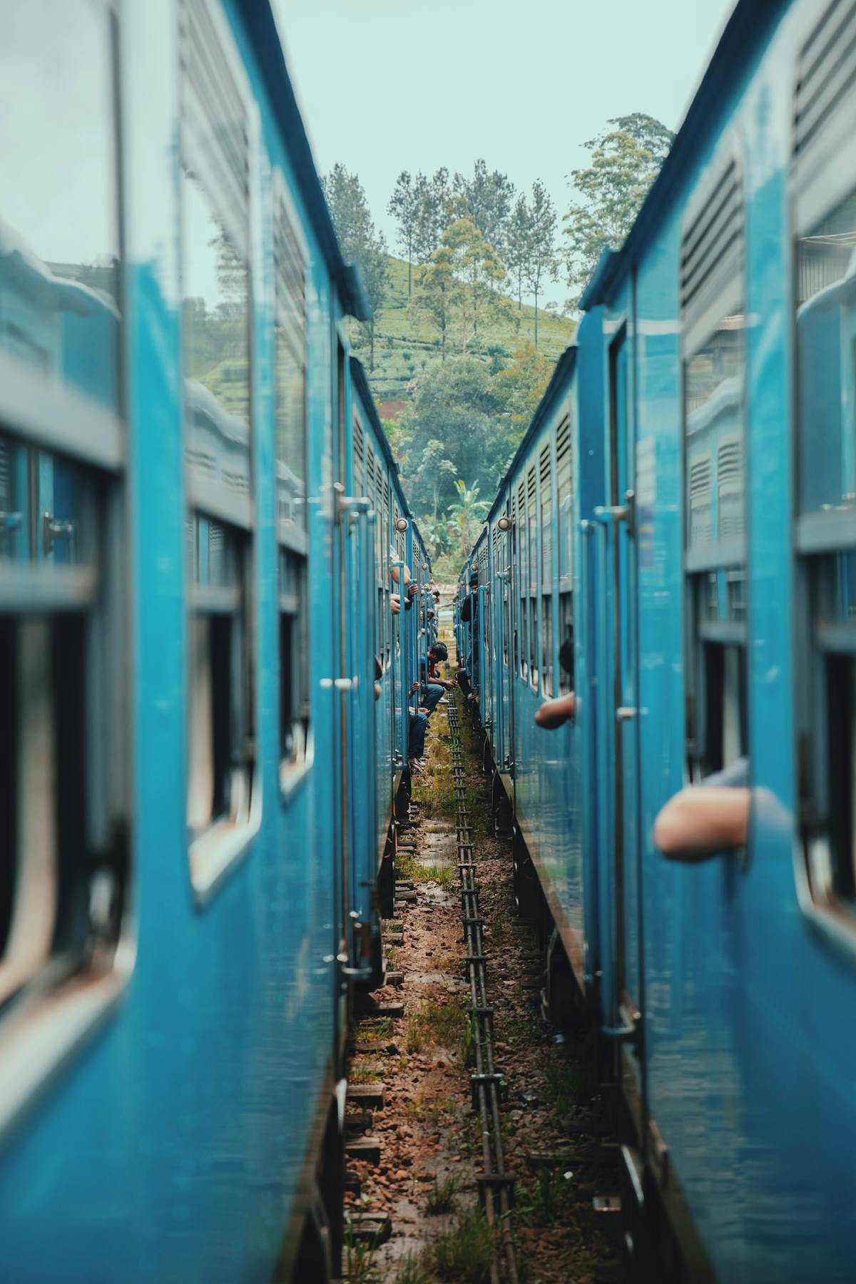 Blue trains aligned on tracks at Colombo railway station in Sri Lanka